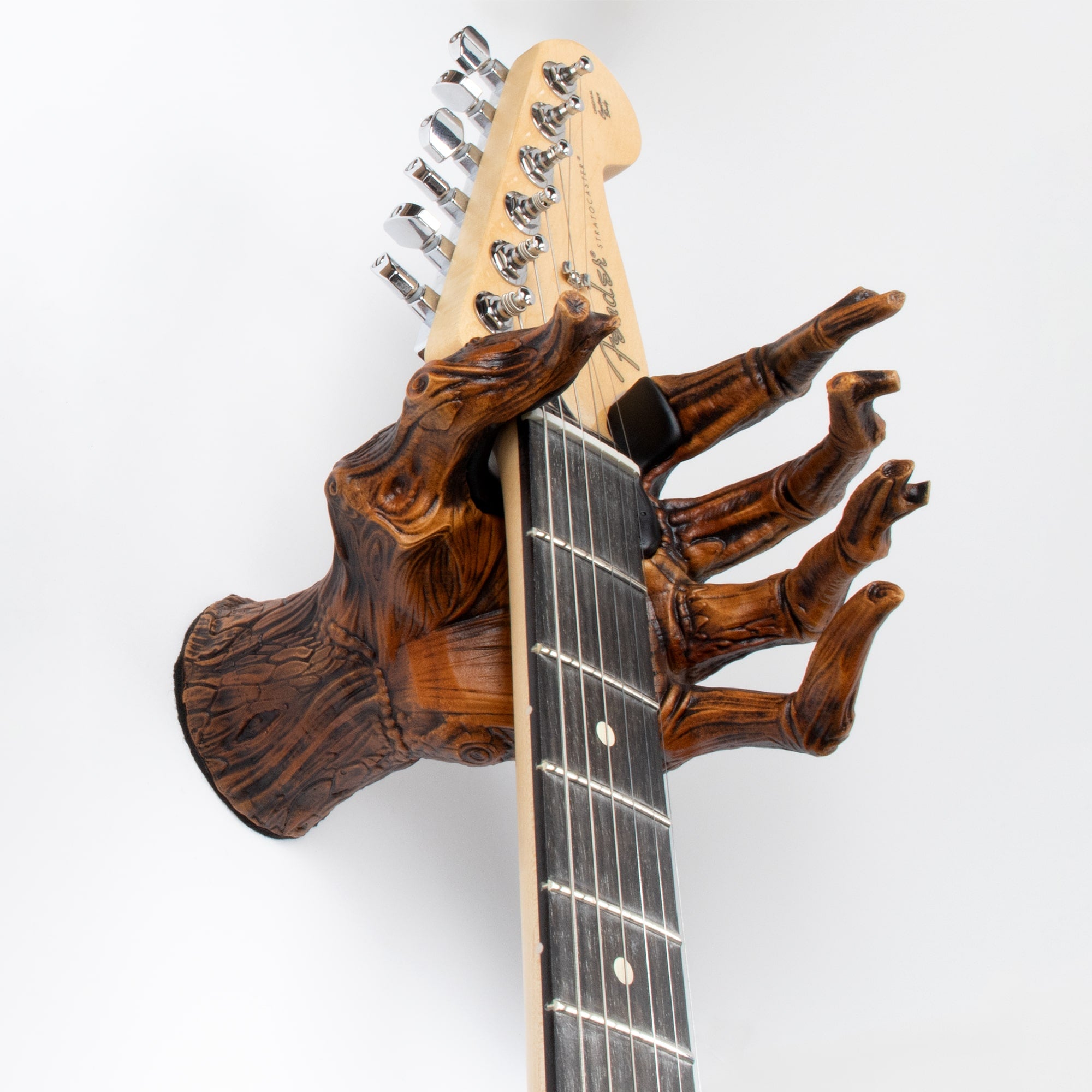 guitar wall mount hook holding stratocaster electric guitar.