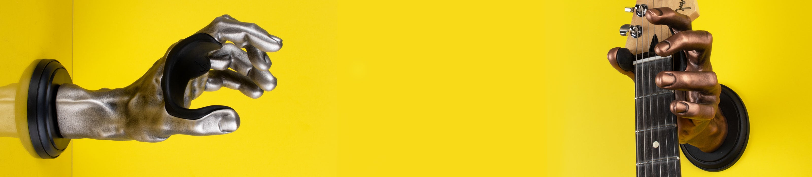 Classic Grip collection of hand-shaped guitar wall mount hangers for instrument display on yellow background. 