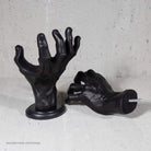 Black decorative wall mount for hanging guitars on the wall.
