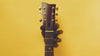 Guitar hanger wall mounts in the shape of a hand in a variety of artistic styles and colors. 