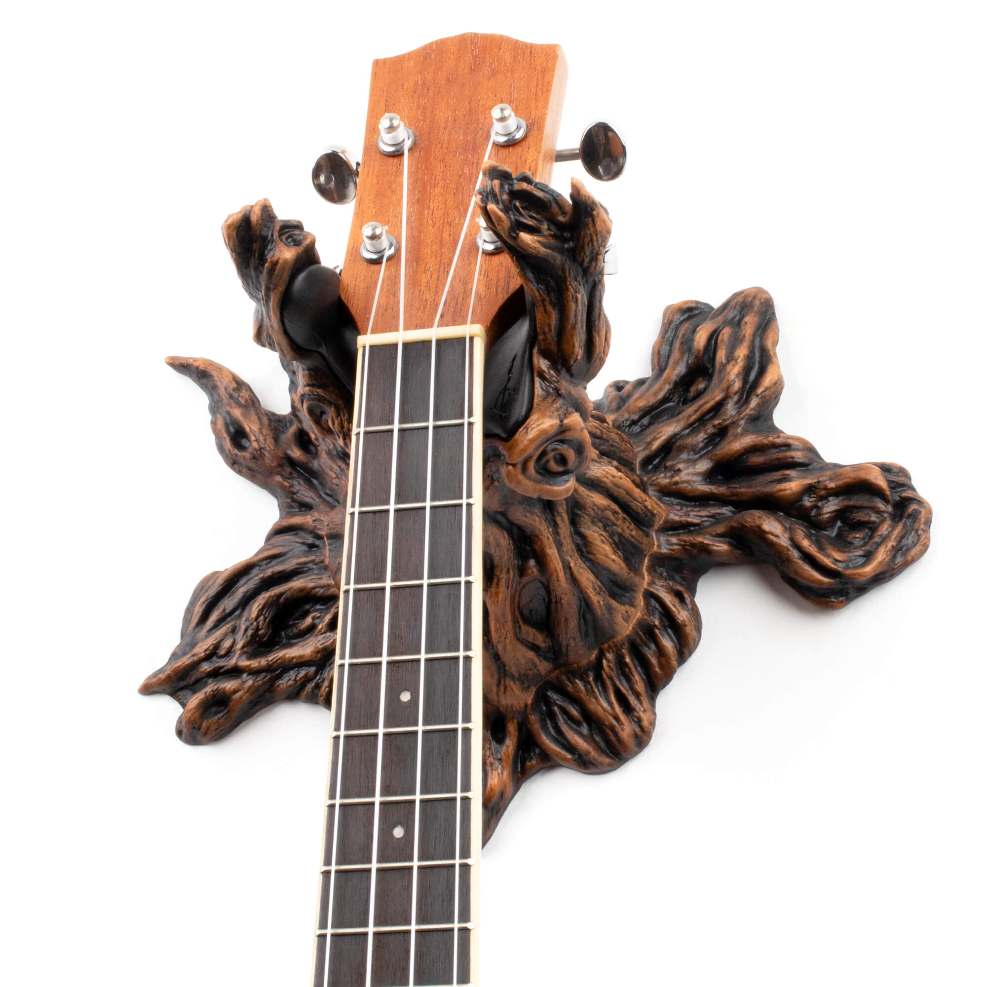 Ukulele wall hanger decorative mount shaped like a tree.
